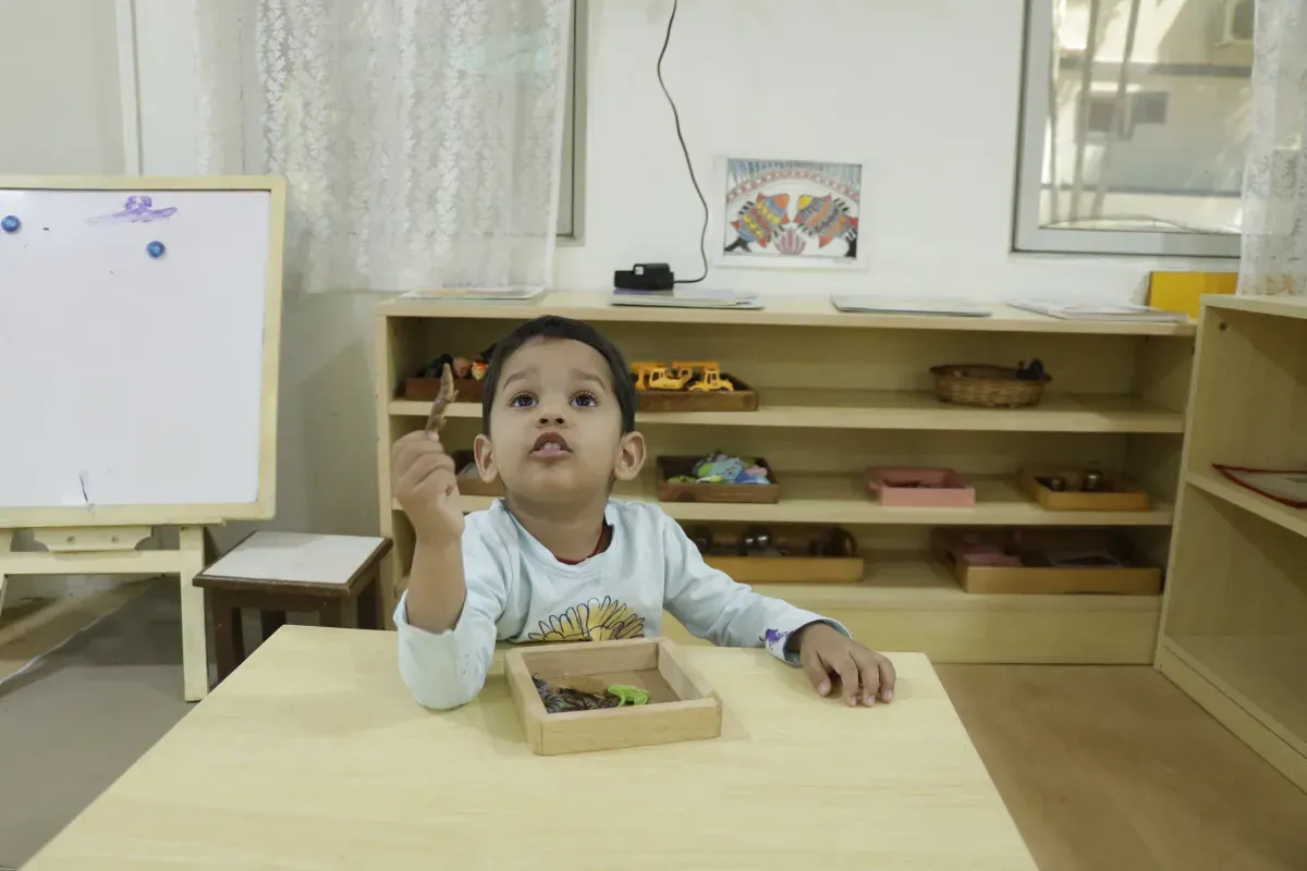 Guide showing objects to toddler